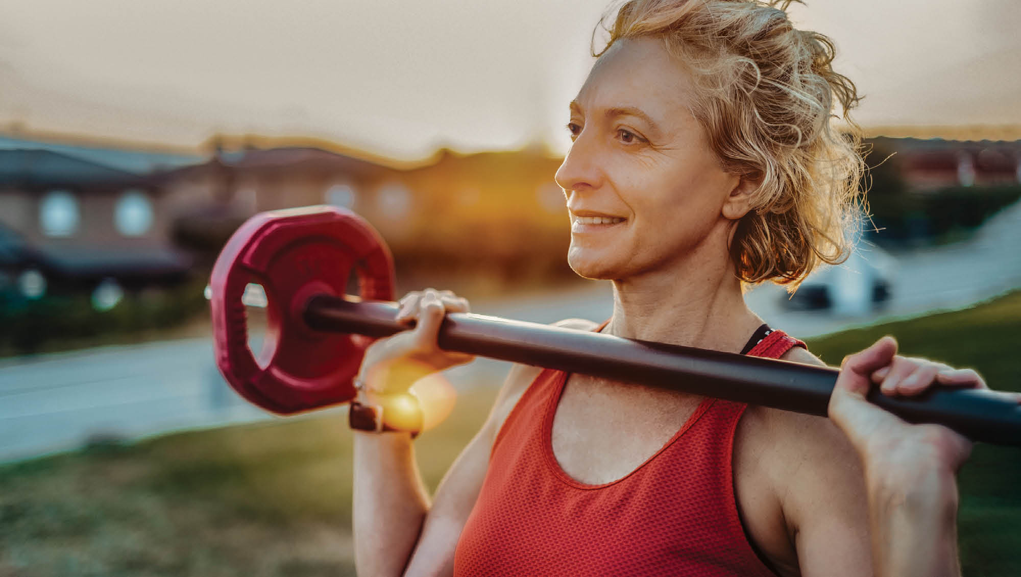 a woman lifting a barbell