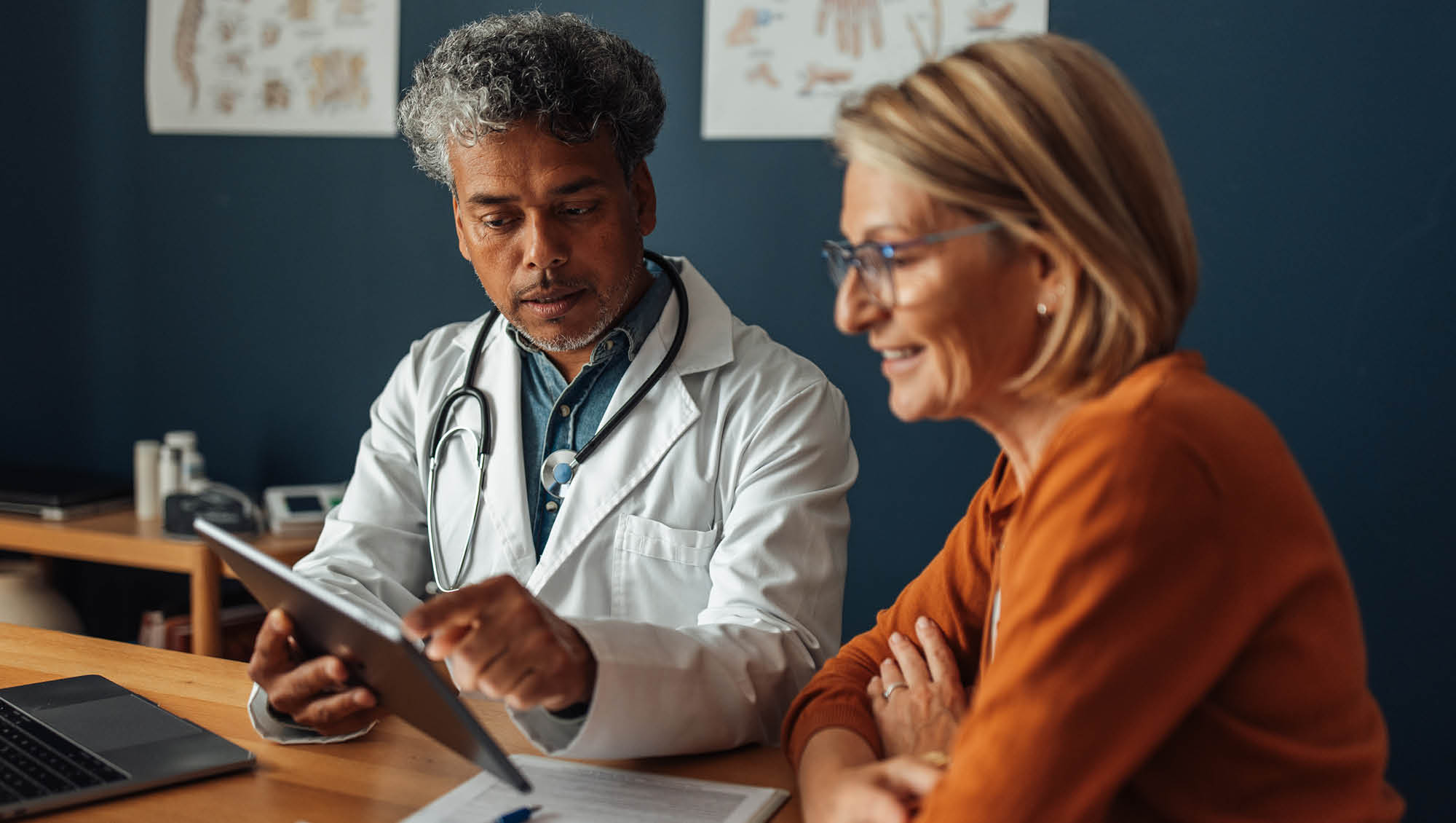 a doctor talks with a patient about test results
