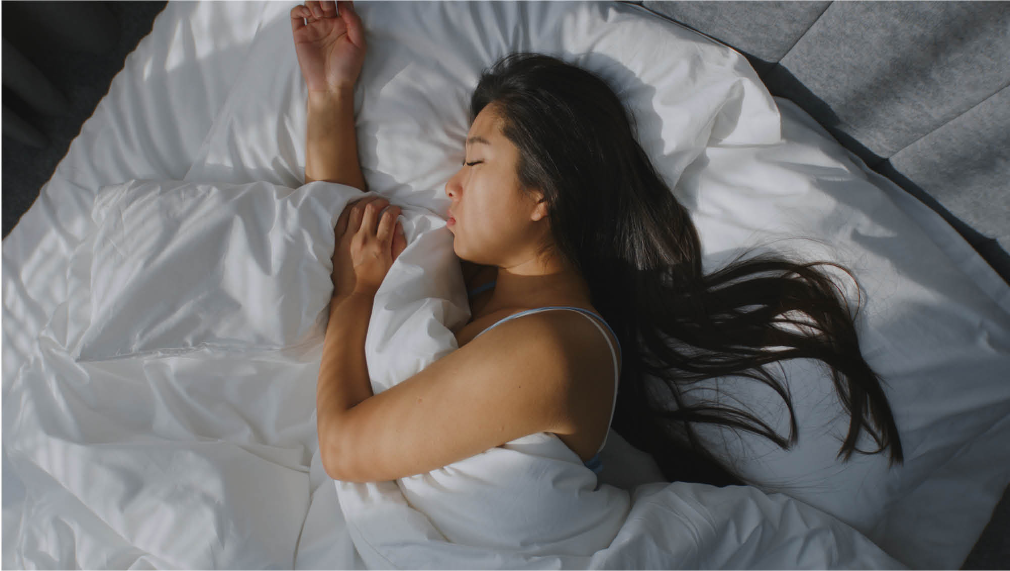 a woman sleeping in bed