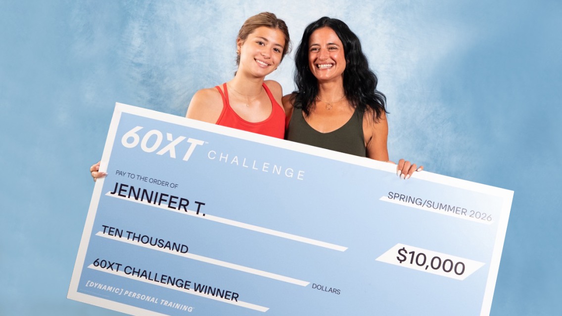 60XT grand prize winner holding her large check.