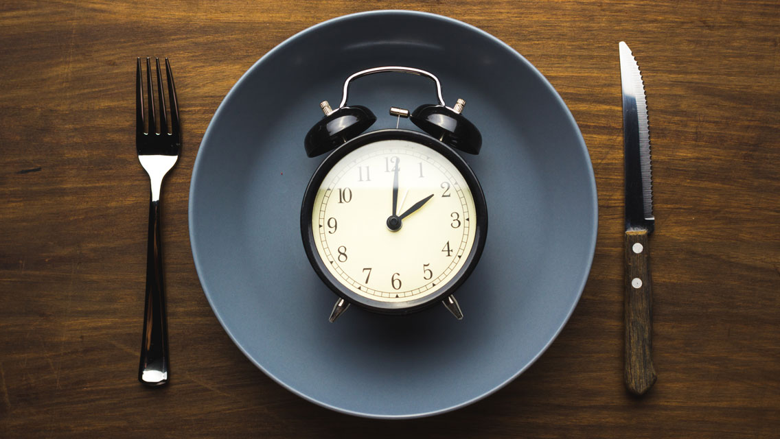 old fashioned clock on a plate