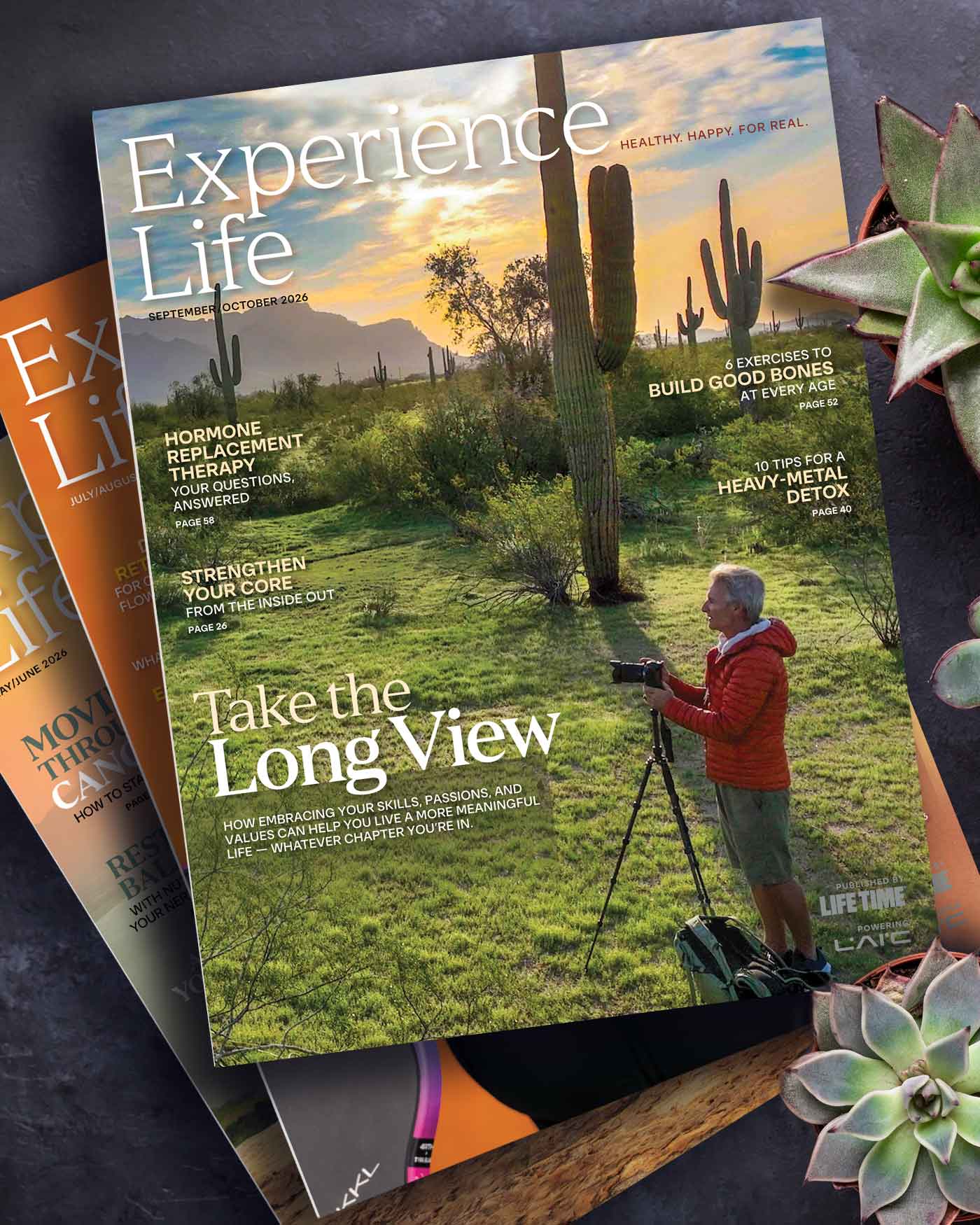 Sept/Oct 2026 cover of Experience Life with person taking picture in cactus field