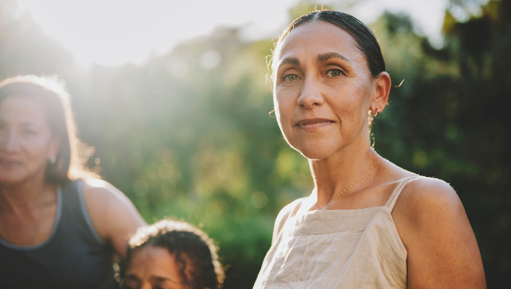 a middle aged woman looks at the camera