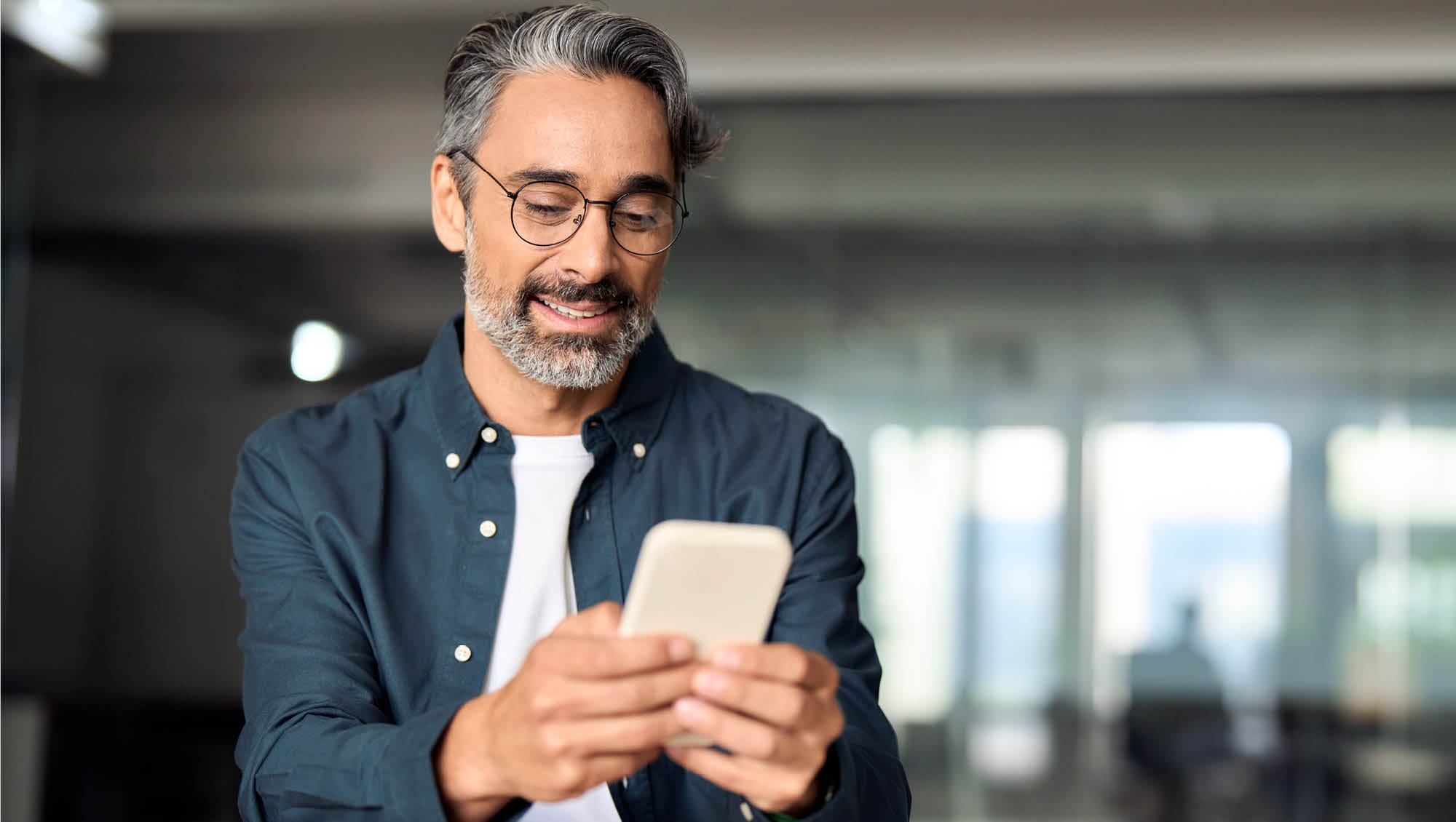 a man looks at his phone