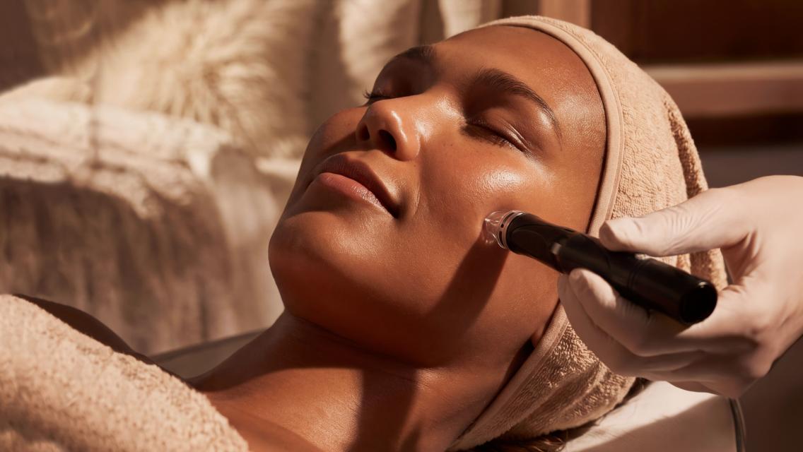 Woman getting laser-free treatment on face.