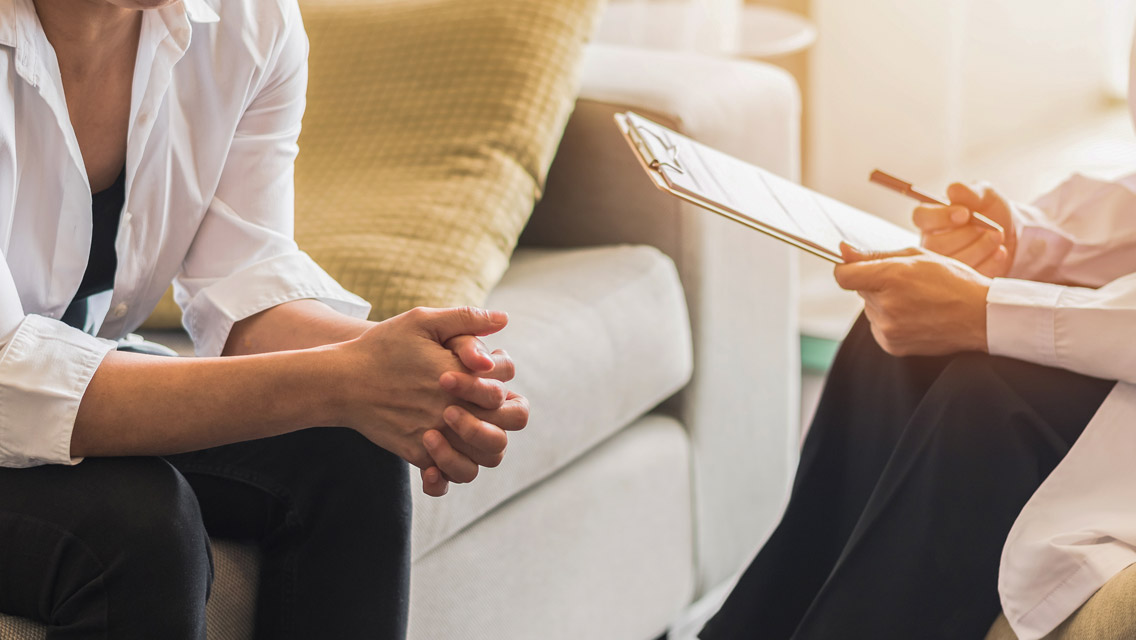 a person talking to a clinician