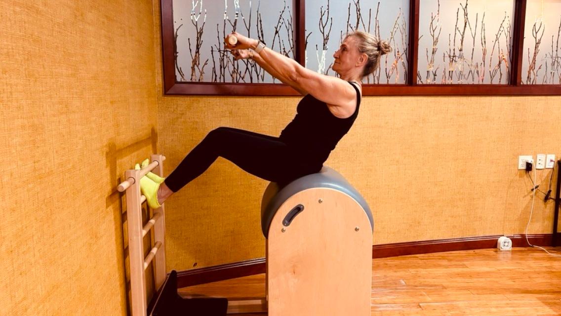 Life time member doing pilates.