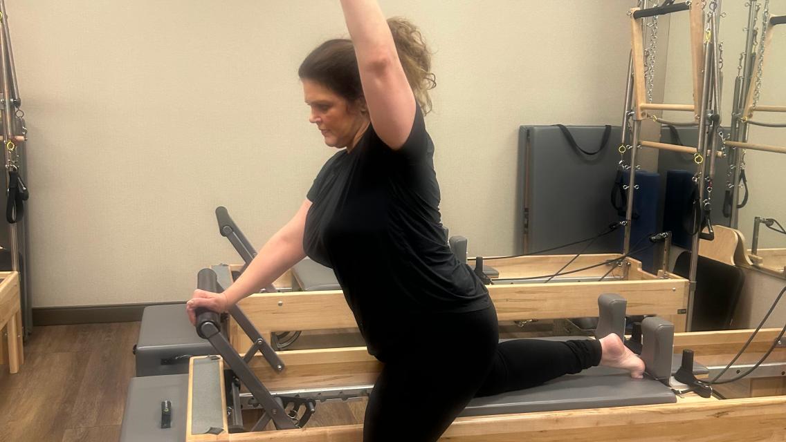Life time member doing pilates.