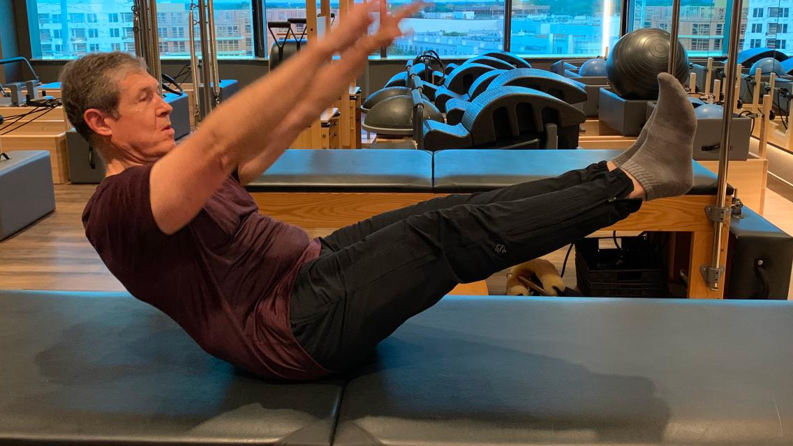 Life time member doing pilates.
