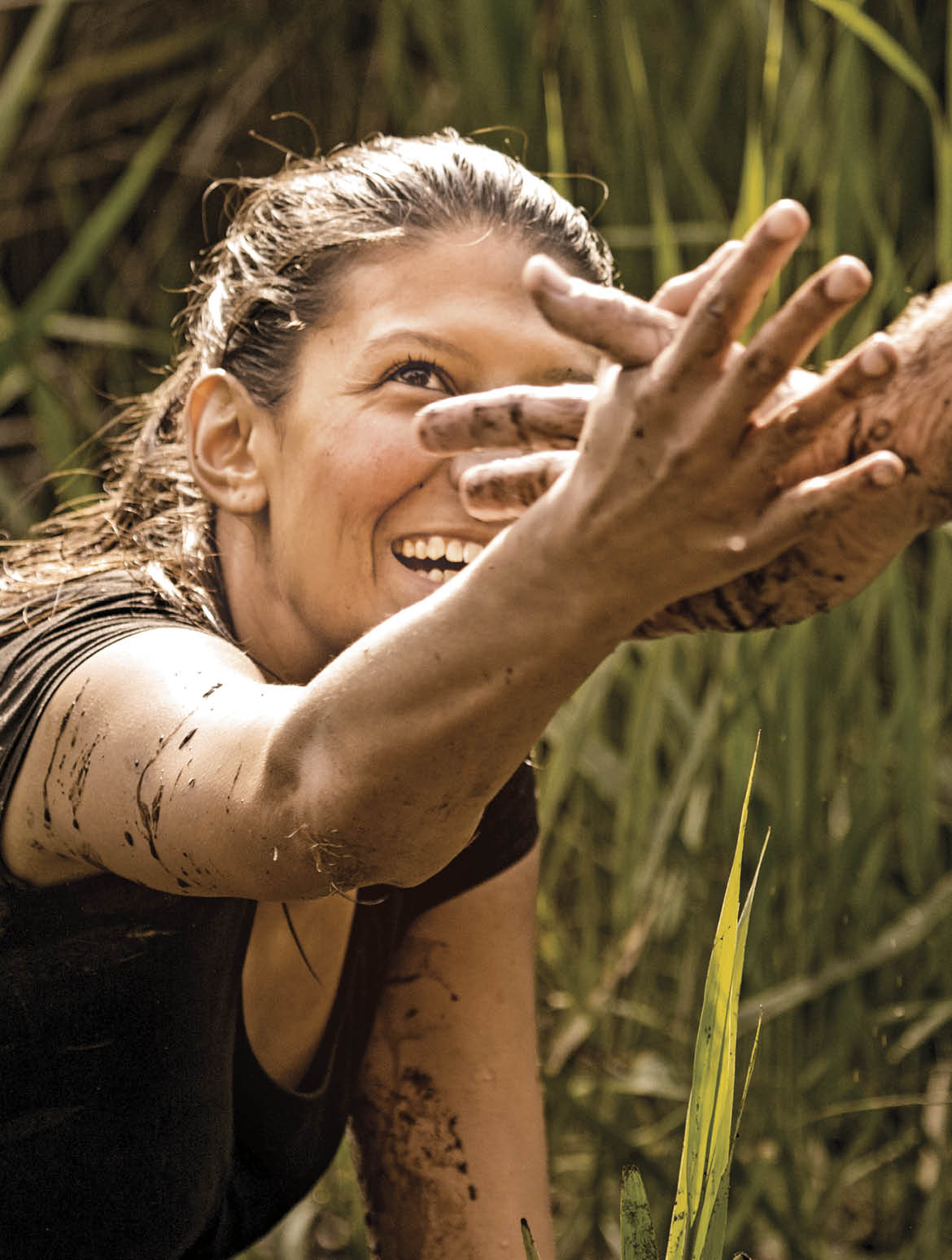 man helping woman to get out of canal