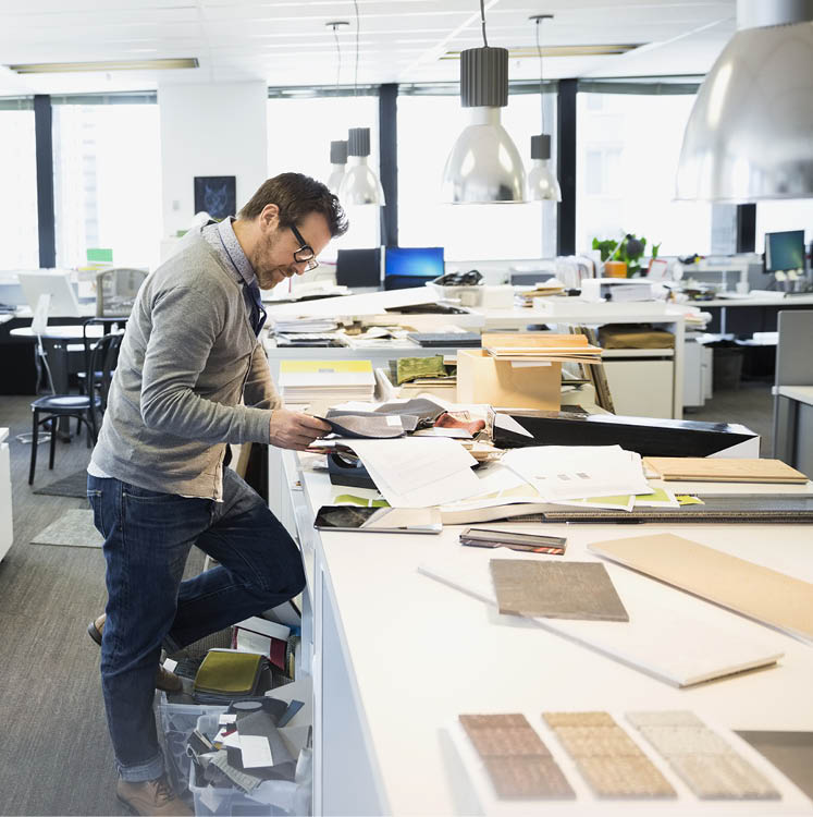 Interior designer working at table in office