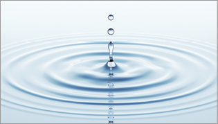 Water droplet on still water 