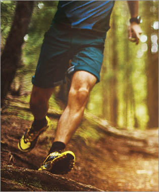 Man trail running in the forest