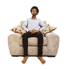 content young man sitting meditating in comfy chair