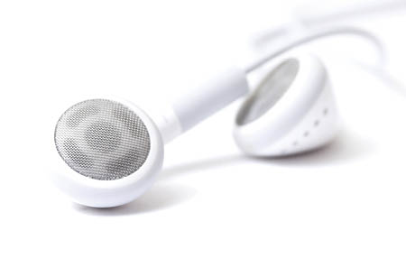 Isolated high key image of a pair of modern stereo headphones.