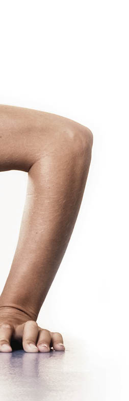 Nice young woman doing push-ups in fitness club. 