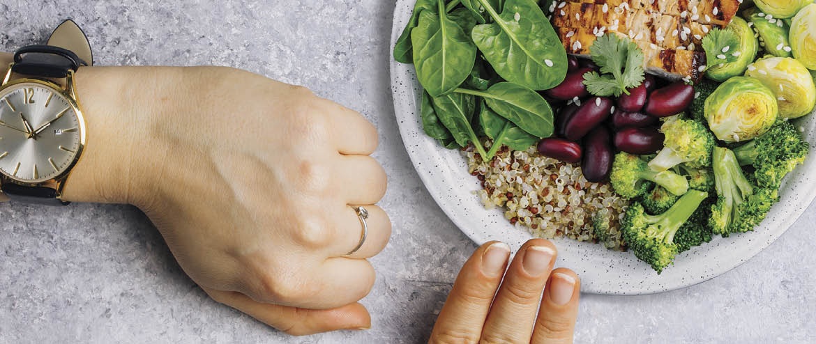 Intermittent fastin concept - countdown to eat salad with avocado  grapefruit and shrimps in bowl