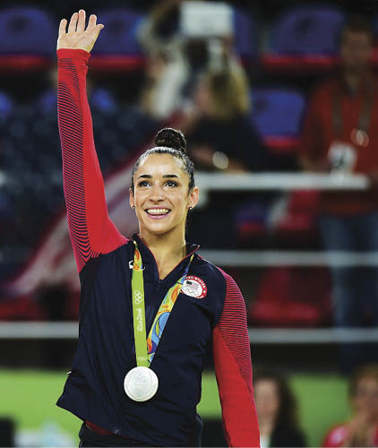 RIO DE JANEIRO, BRAZIL - AUGUST 11:  Silver medalist Alexandra Raisman of the United States celebrates on the podium at the medal ceremony for the Women's Individual All Around Final on Day 6 of the 2016 Rio Olympics at Rio Olympic Arena on August 11, 2016 in Rio de Janeiro, Brazil   (Photo by Harry How Getty Images)