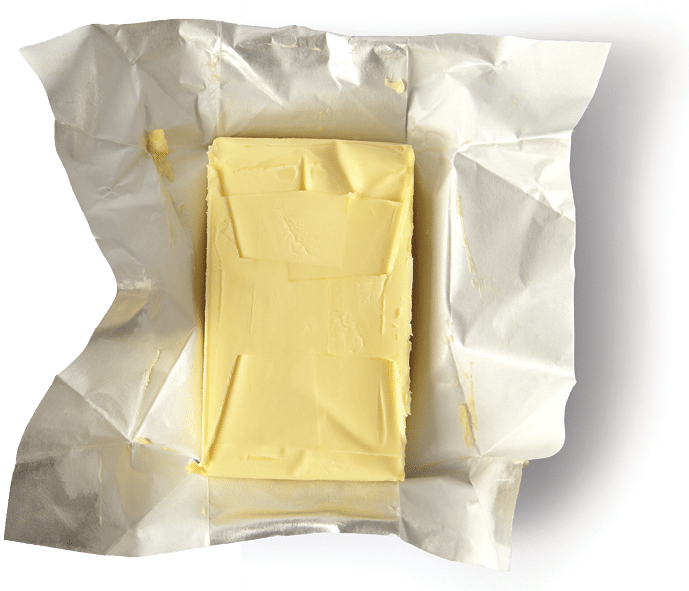 Piece of butter isolated on white background, top view