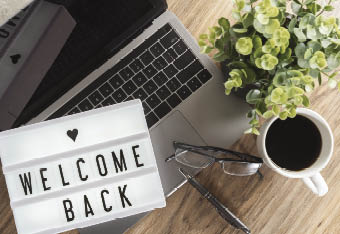 welcome back showed on light box at workspace during the covid-19 