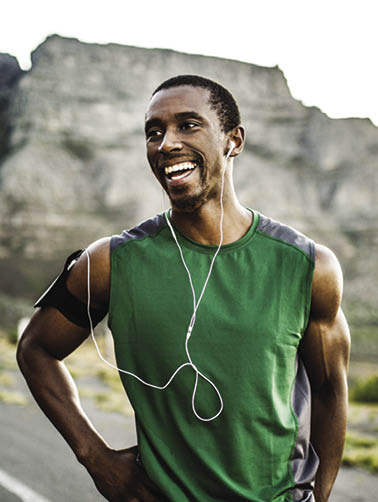 African athlete smiling positively after a good training session outdoors