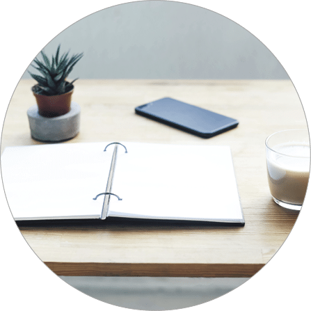 Workplace with notepad, coffee and smartphone  List of tasks, cases, desires  Timetable 