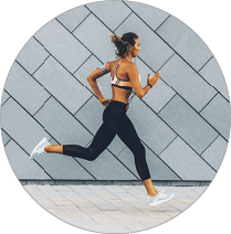 Beautiful young woman jogging in the city 