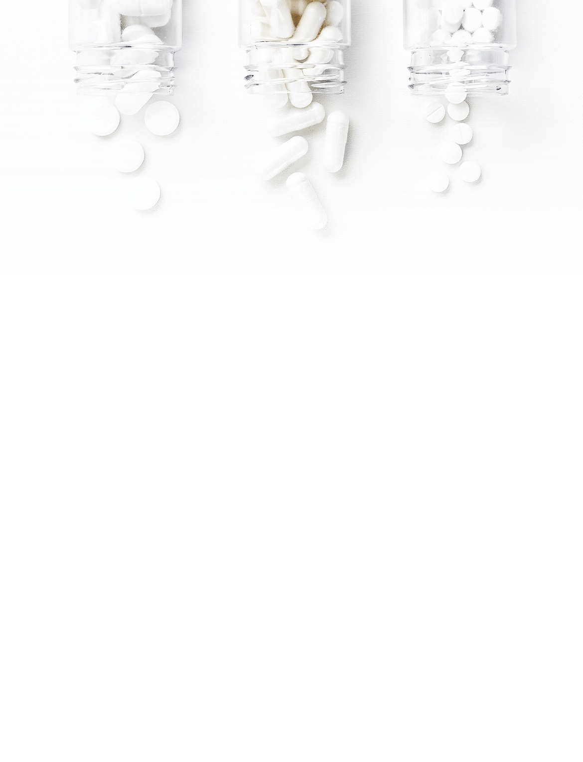 Three packages with various white pills on a white background  Health concept  Top view with copy space 