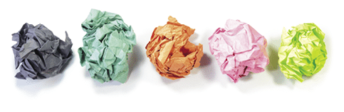 Multi color crumpled paper balls on a white background 