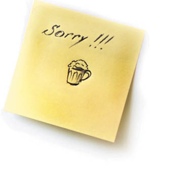 The sticker on the white wall with the message: I'm sorry and the picture of the glass with beer  Concept, messages of trying 