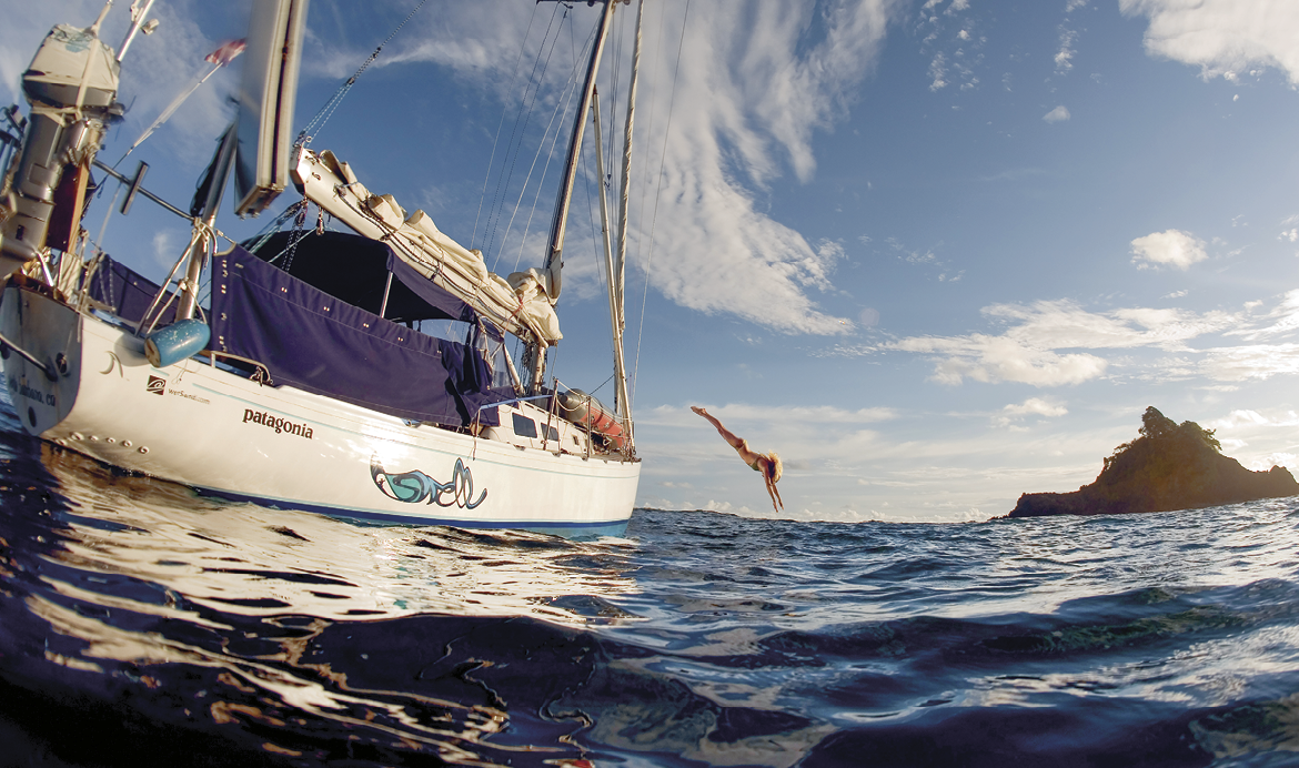 THIS PHOTO IS LICENSED FOR PR   PROMOTION OF PATAGONIA BOOK  Swell by Captain Liz Clark  ONLY  Once the anchor is set, a saltwater rinse takes away the sweat and angst of a difficult passage—the rewards of the sea as my backyard  PHOTO: JACK BUTTLER