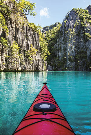 Front view of a kayak in a beautiful turquoise lagoon in the Philippines 