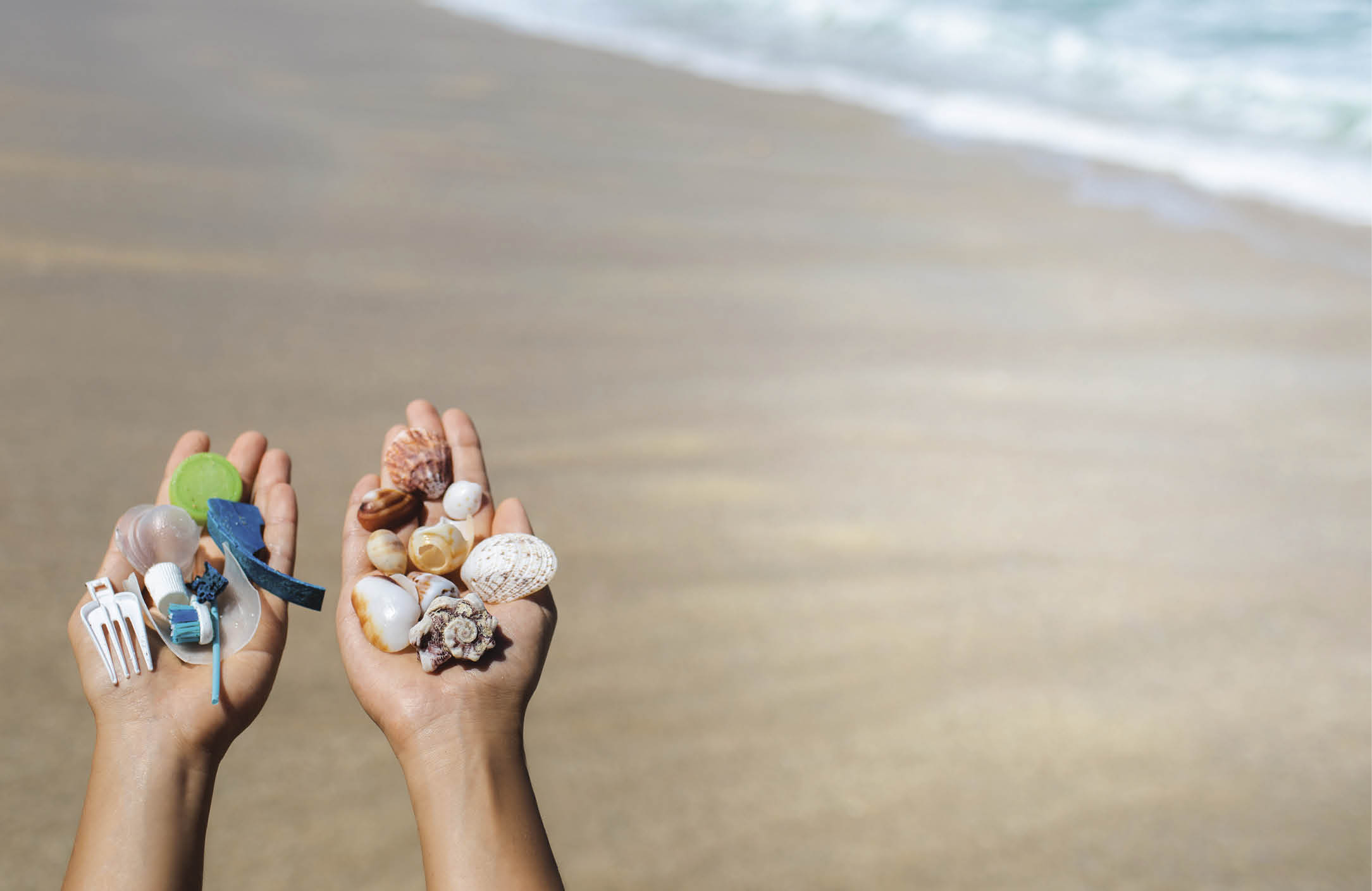 Concept of choice: save nature or continue to use disposable plastic  One hand holding beautiful shells, in the other - plastic waste  Ocean and tropical beach on background  Environmental pollution problem 