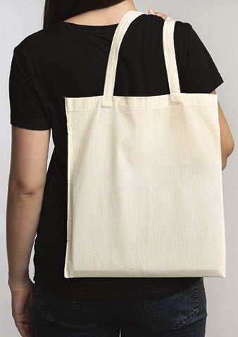Say No To Plastic  Unrecognizable Brunette Girl Holding Eco Bag On White Studio Background  Back View, Cropped, Free Space