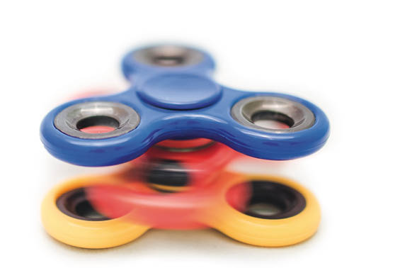 Group of fidget spinner stress relieving toys isolated on white 