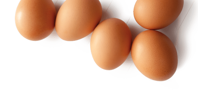 Brown organic eggs isolated on white