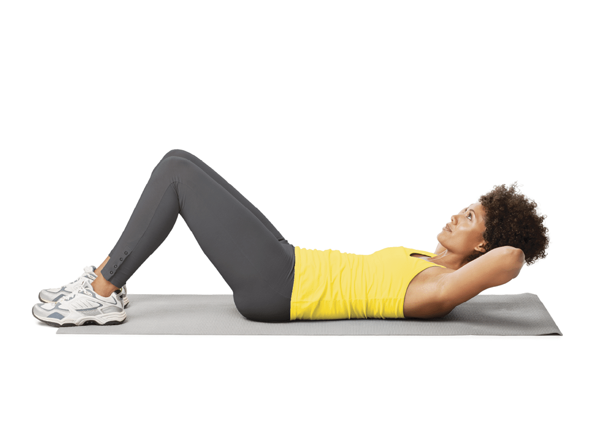 Side view of a young woman lying on the ground while doing ab crunches  Horizontal shot  Isolated on white 