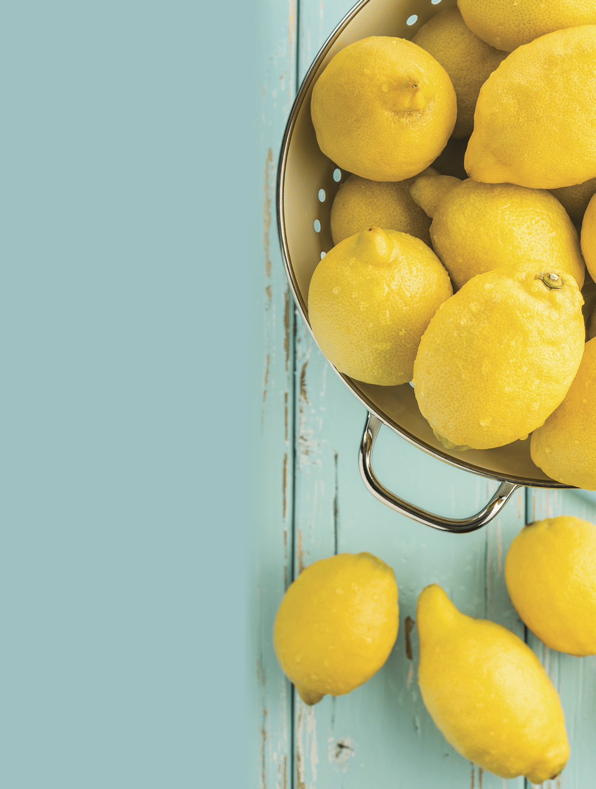 Fresh lemons in retro colander 