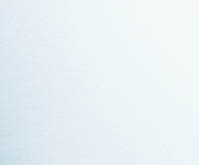 Woman standing on stone pathway in lake with arms outstretched and scarf blowing in wind