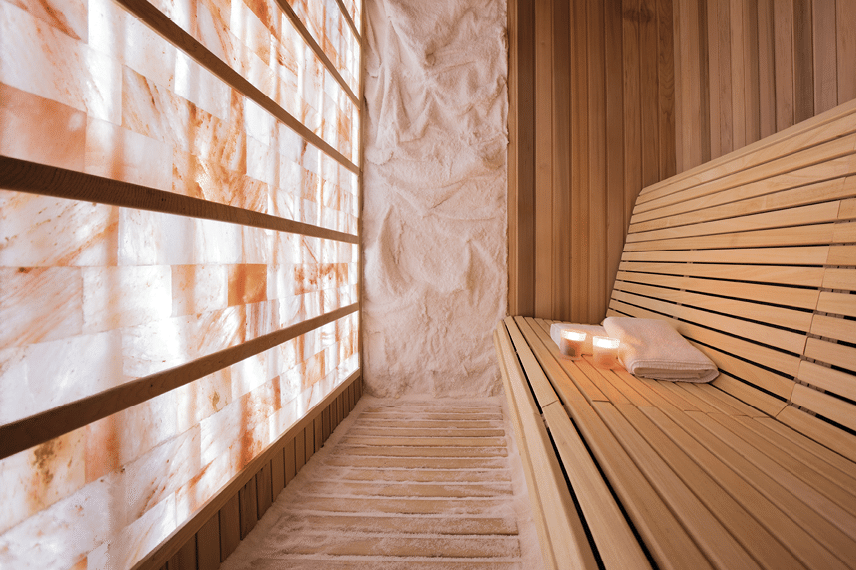 Salt room made of wood with walls made of salt  Halotherapy is a form of alternative medicine  Photo taken under the available light from glowing wall  