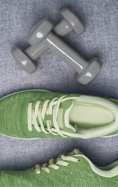High Angle View Of Dumbbell and Sport Shoes
