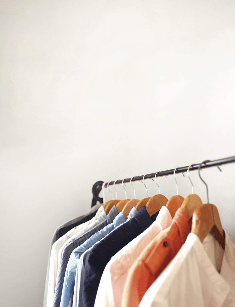 Open wardrobe is usually adapted for a small living space  The shirts  dresses or coats are hanged on a clothing rail  and some shelving at the bottom 