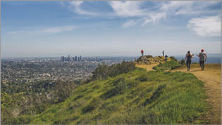 Griffith Hills Park at sunset, and panoramic view of Los Angeles city from Hollywood Hills  Los Angeles, California USA - April 8, 2018