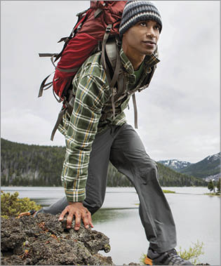 A man backpacking near a lake 