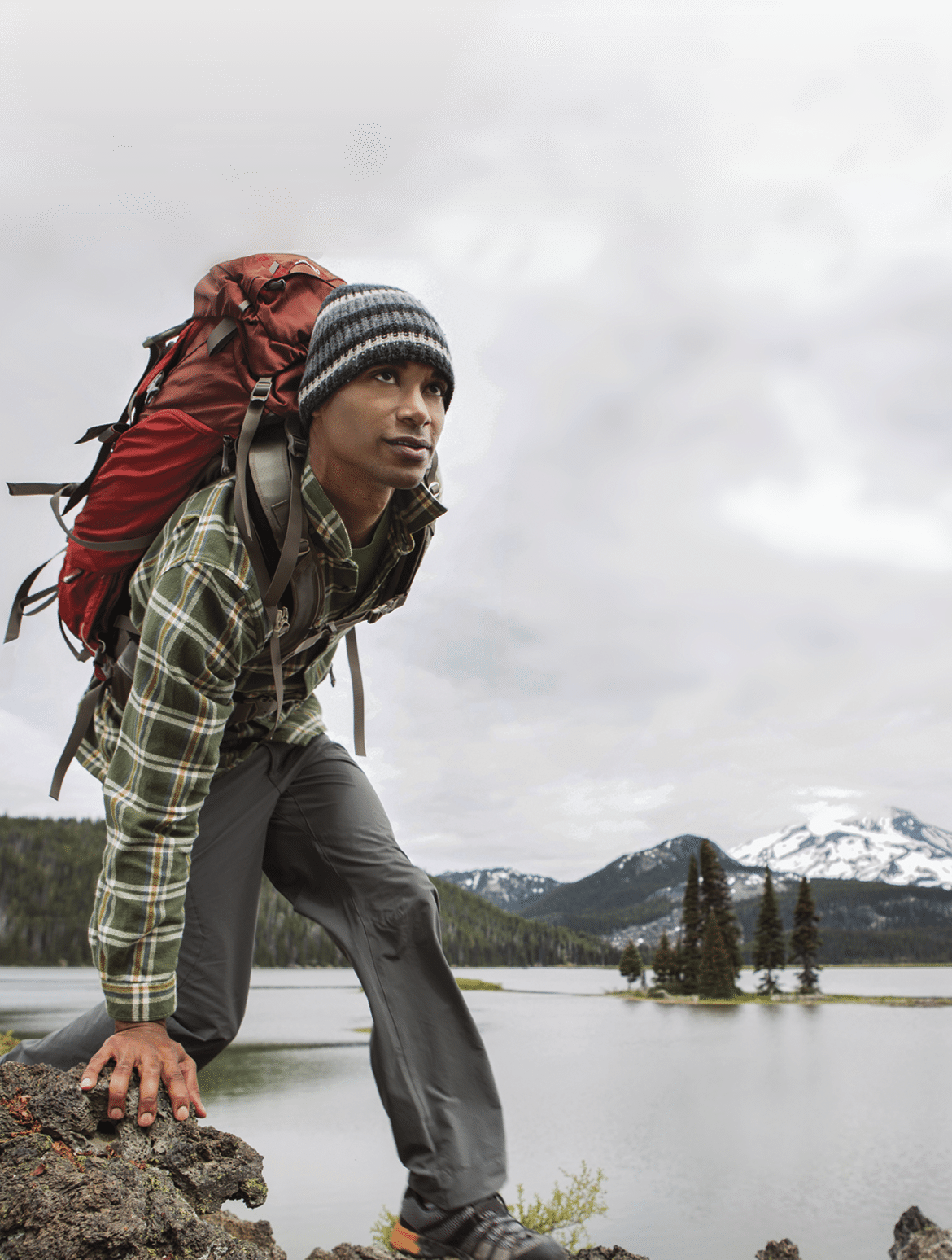 A man backpacking near a lake 