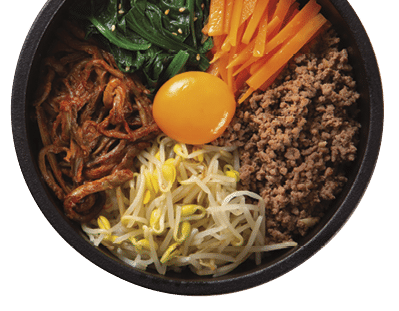 This is a photograph of Stone-grilled bibimbap on a white background